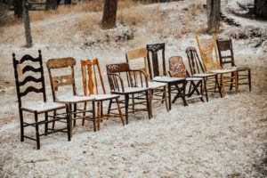 vintage wooden chairs in the snow